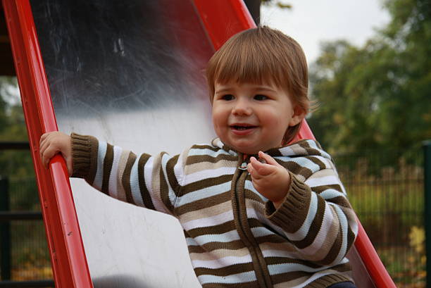 istock little boy on the playground in autumn 450876117