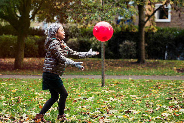 istock Young Girl Catching a ball 450876133