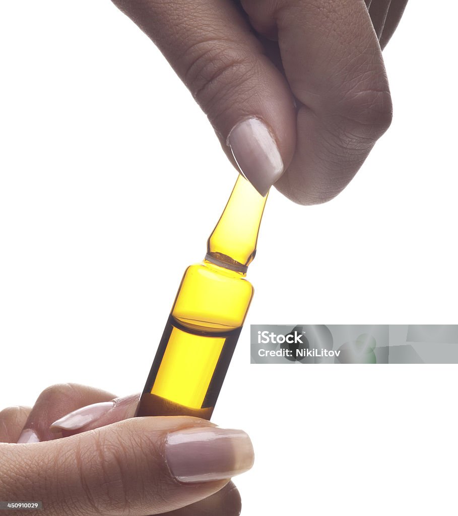 blister Hands holding an ampoule on a white background Injecting Stock Photo
