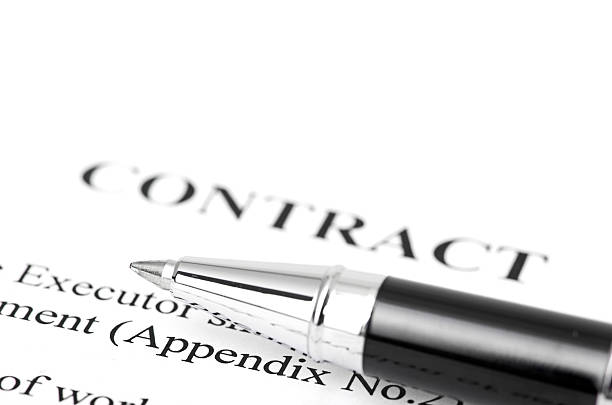 istock Close-up of silver pen on contract. 450942183