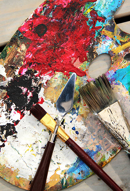 istock Art palette and mix of paintbrushes 450947771