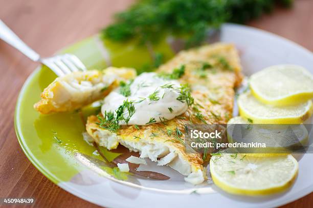 Fried Fish With Sliced Lemons On The Side Stock Photo - Download Image Now - Tilapia, Perch - Fish, Fish