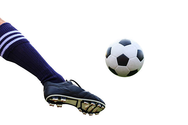 istock foot kicking soccer ball isolated with clipping path 450954257