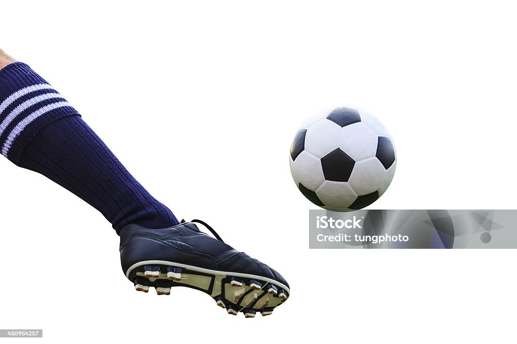 foot kicking soccer ball isolated with clipping path Black Color Stock Photo