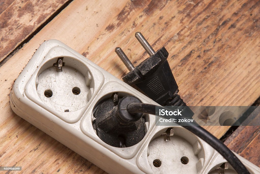 plug and socket plug and socket on the floor Amperage Stock Photo