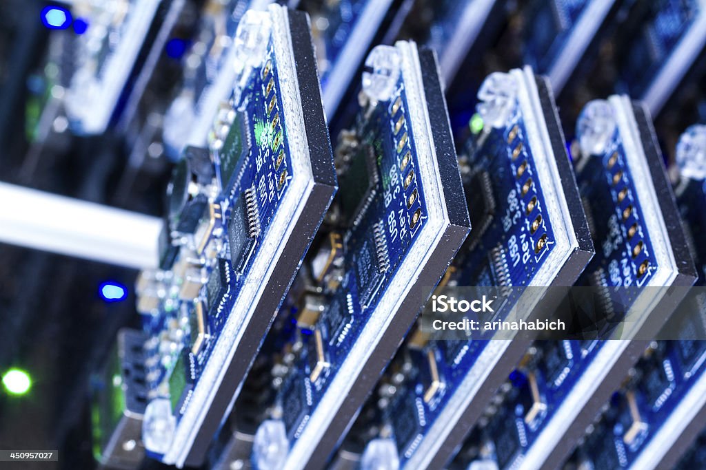 Bitcoin mining Bitcoin mining USB devices in a row with small fans. Bitcoin Stock Photo