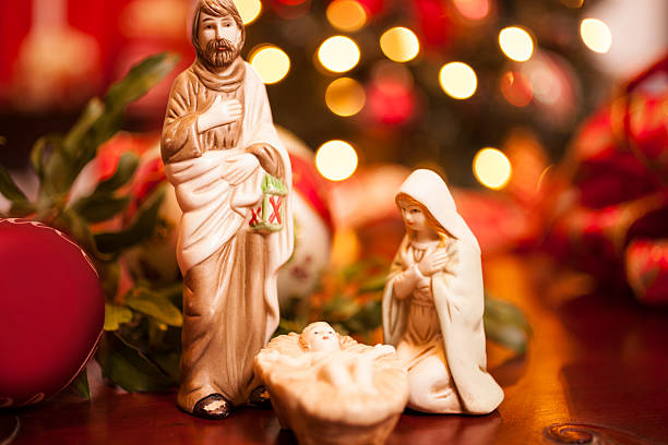 istock Christmas: Close-up of nativity scene.  Lighted tree background. 450968209