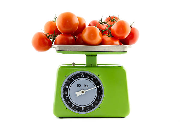 tomatoes on a kitchen scale green vintage kitchen scale with tomatoes on it 1814 stock pictures, royalty-free photos & images