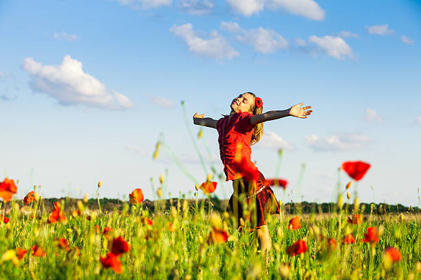 istock Girl in poppies 450981261