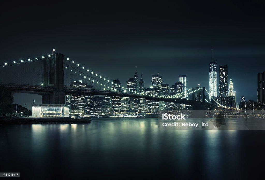 New York skyline at night New York skyline at night with a reflection on the river. New York City Stock Photo