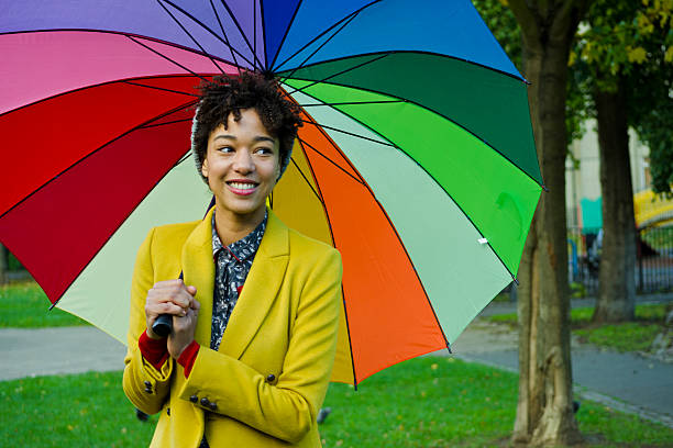 istock Smiling Woman Under An Umbrella. 451017705