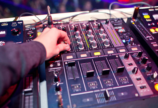 Dj mixing in night club stock photo