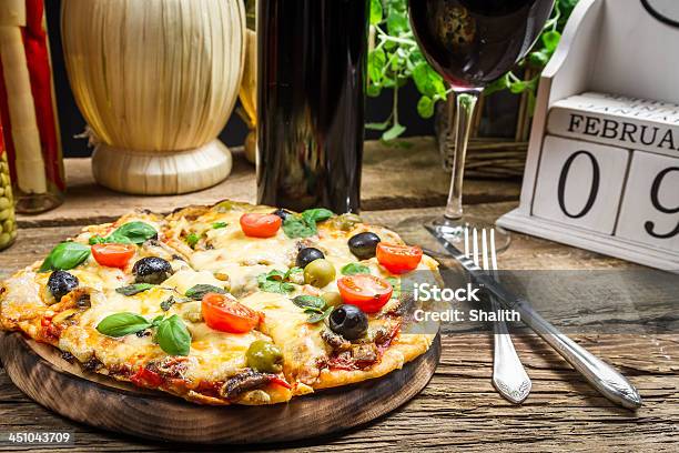 Freshly Pizza Served With Red Wine Stock Photo - Download Image Now - Basil, Black Olive, Brown
