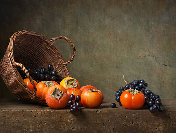 Still life with persimmons and grapes