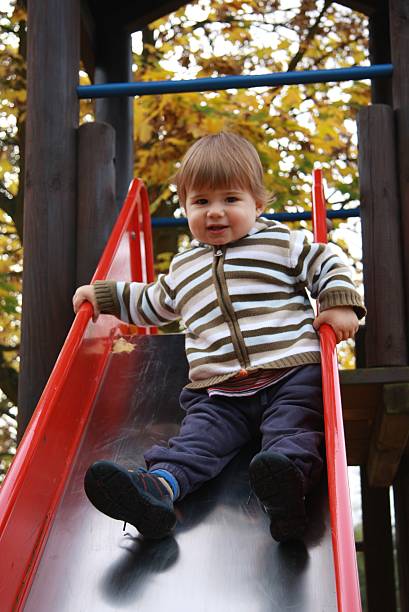 istock little boy on the playground in autumn 451054535