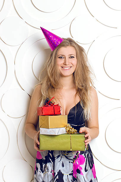 istock beautiful girl with gift boxes 451055569