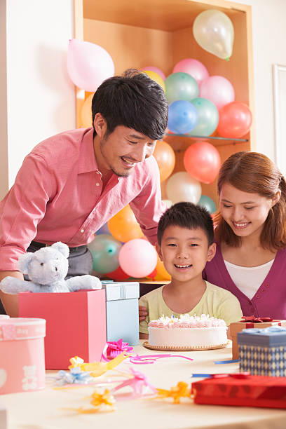 Family Celebrating Son's Birthday