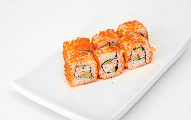 istock Sushi with chopsticks isolated over white background 451057861