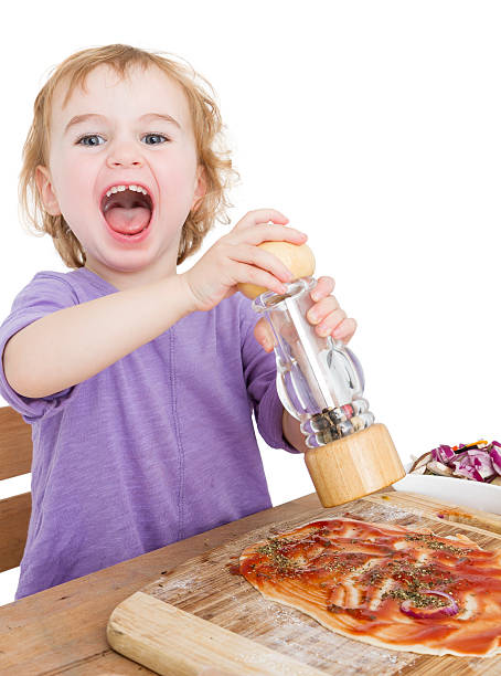 happy child making pizza stock photo