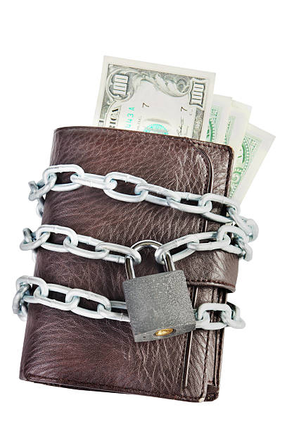 istock Wallet full of money is chained with a locked padlock 451058815