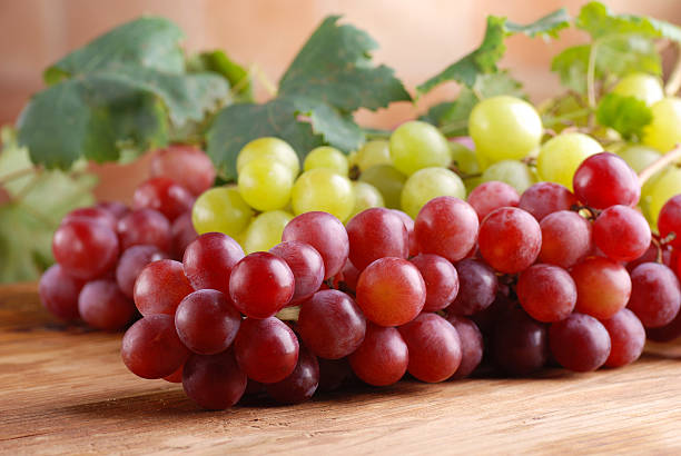 istock bunches of red and green grapes 451059311