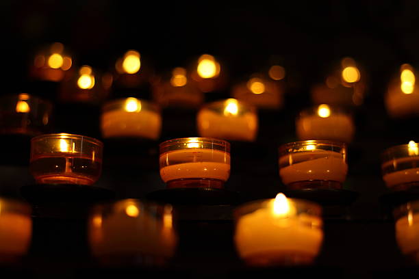 istock burning candles in church 451066701