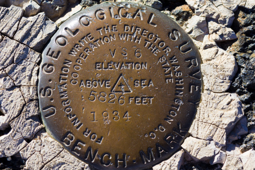This Survey Marker was placed 79 years ago! It shows the elevation above sea level. In very good condition. Seen on Grand Canyon walking path.