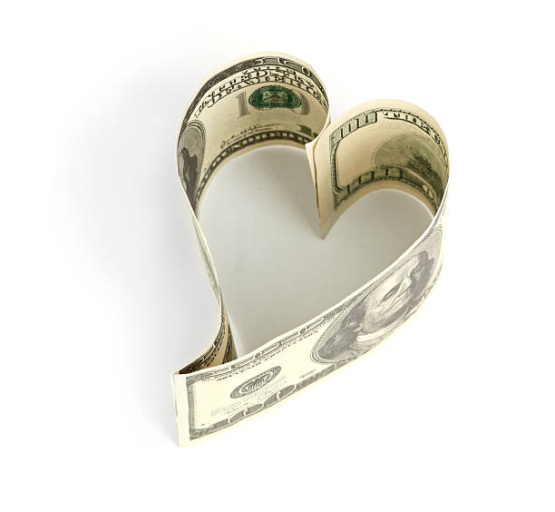 istock Dollar in form of heart isolated on white background 451068011