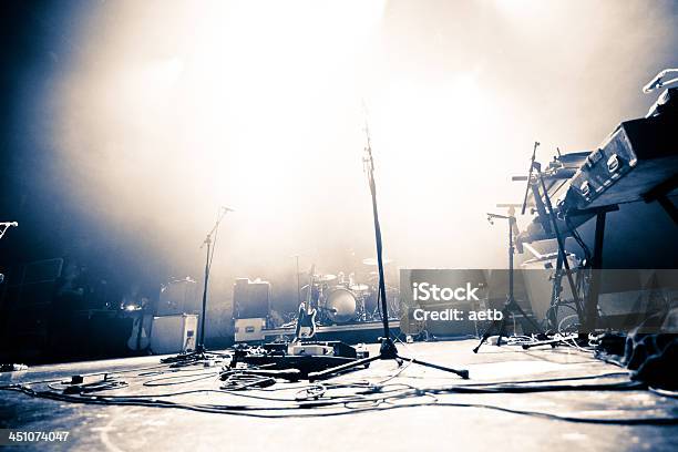 Empty Stage Littered With Musical Accessories Stock Photo - Download Image Now - Stage - Performance Space, Rock Music, Music