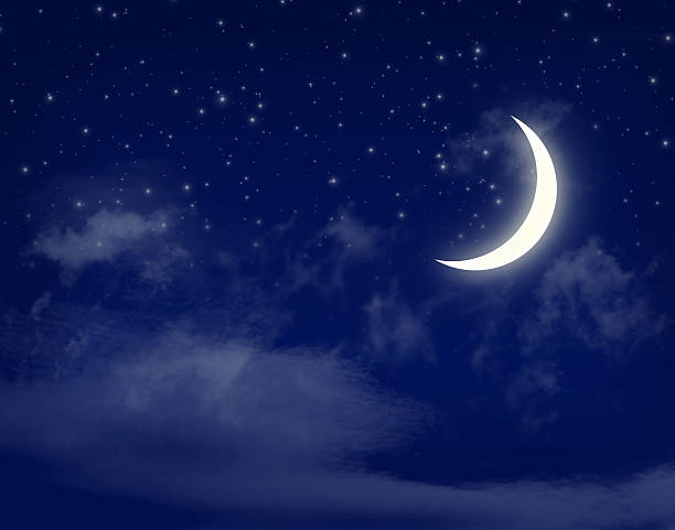 istock Moon and stars in a cloudy night blue sky 451074681