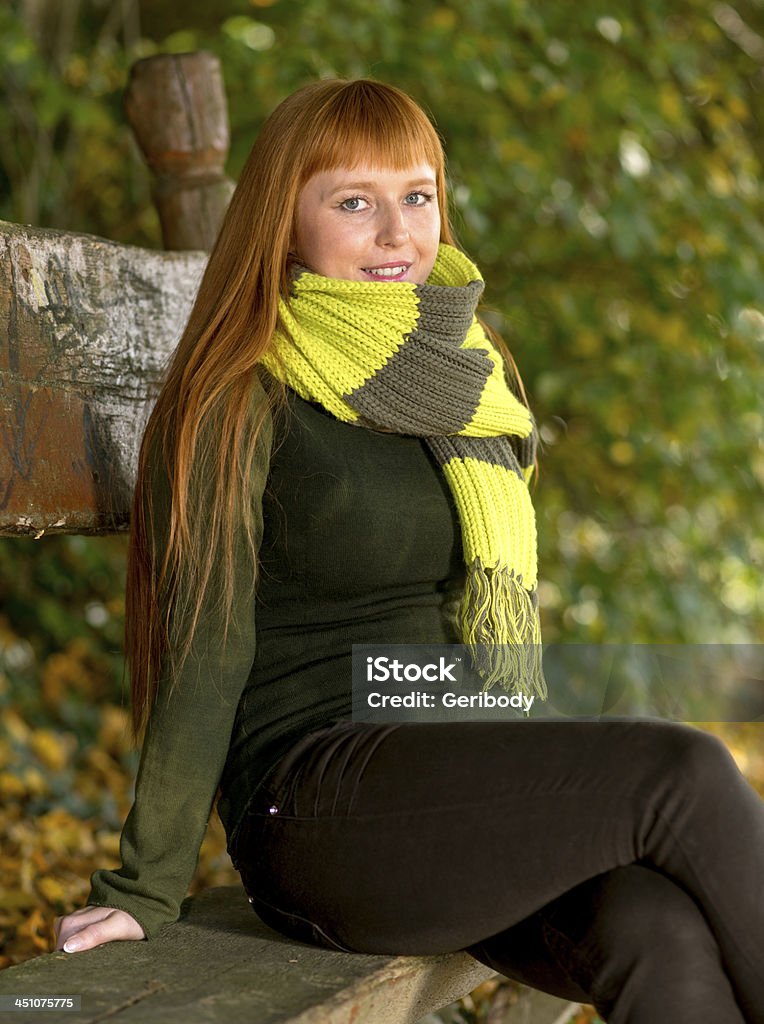 Beautiful long red haired woman in the autumn park Adult Stock Photo