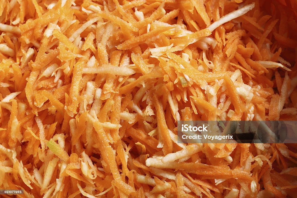 Les carottes râpées Salade de légumes d'arrière-plan - Photo de Carotte libre de droits