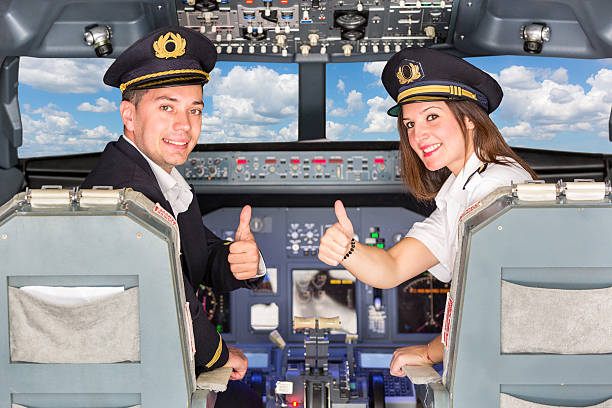 istock Happy Pilots in the Cockpit with Thumbs Up 451095537