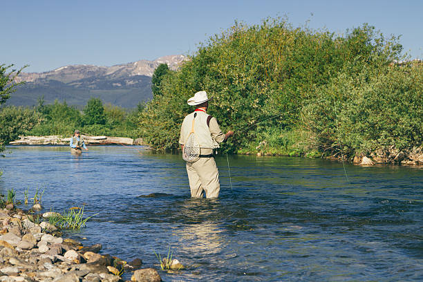istock Fishermen fly fishing 451098371
