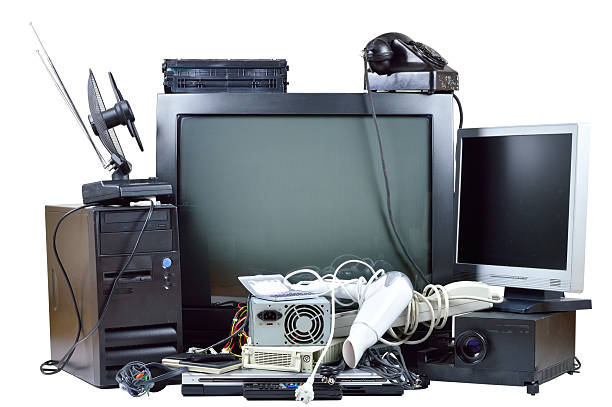 Old and used electric home waste. Old and used electric home waste. Obsolete pc computer, telephone, CRT monitor, DVD. e waste photos stock pictures, royalty-free photos & images