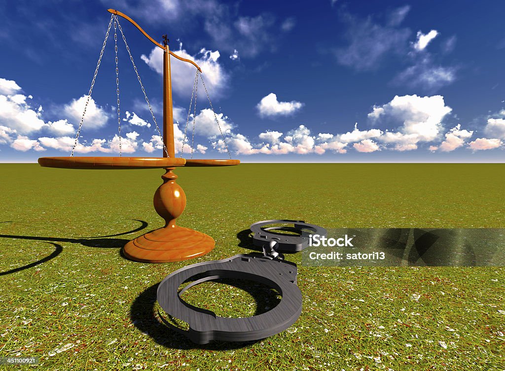 Scales of justice and handcuffs Scales of justice and handcuffs concept Balance Stock Photo