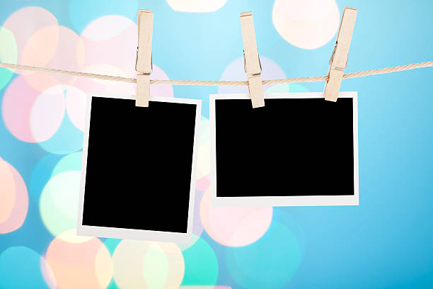 istock Blank photos hanging on clothesline 451126453