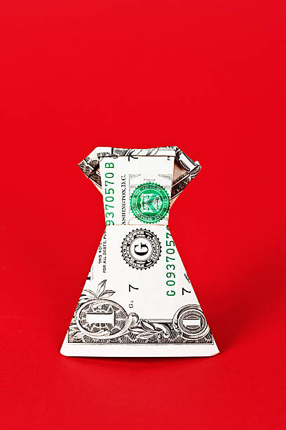 istock The cost of fashion: origami dress folded from dollar bill 451131397