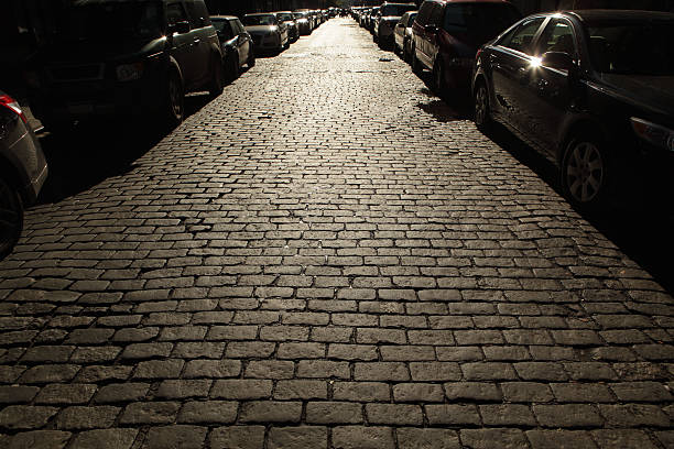 NYC shadow stories. All logos and license plates removed. Back lit with noise in shadows.