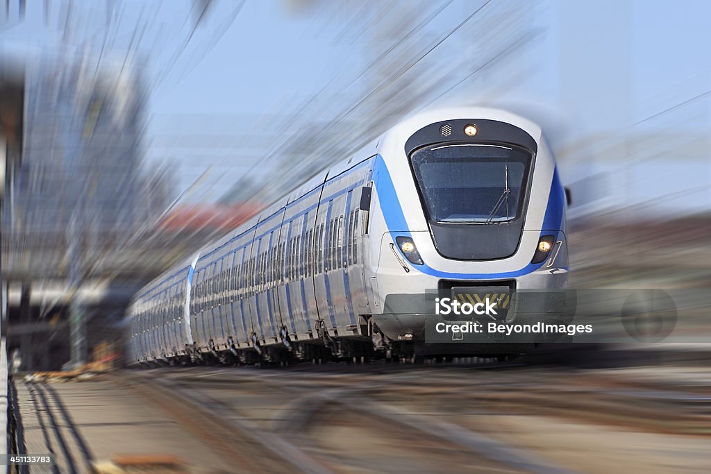 Electric commuter train leaving station - blurred motion Pendeltag electric commuter train leaves city main station - motion blur added to image.  Horizontal, copy space.  NOTE to Inspector: image has been modified. Train - Vehicle Stock Photo