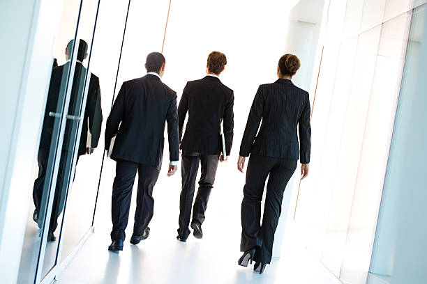istock group of business people walking away 451135425
