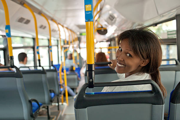 istock Smiling woman in bus. 451153191