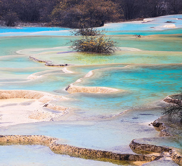 istock colorful travertine ponds in huanglong 451155107
