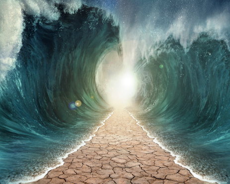 The seas are being parted with a pathway through the ocean.