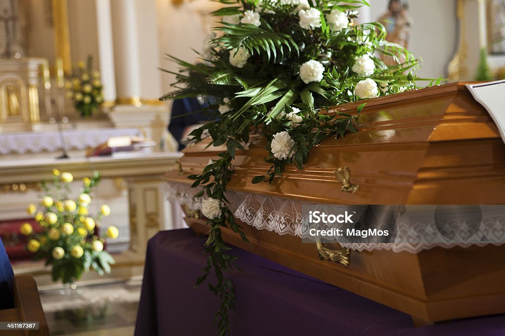 Flowers on a coffin in the church Rest In Peace Funeral Stock Photo