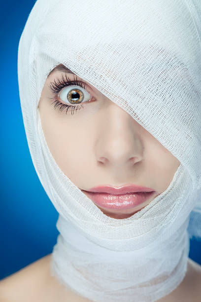 istock woman with bandage 451187777