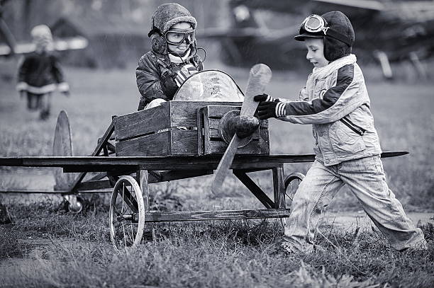 istock Children playing as pilots with homemade airplane 451188775