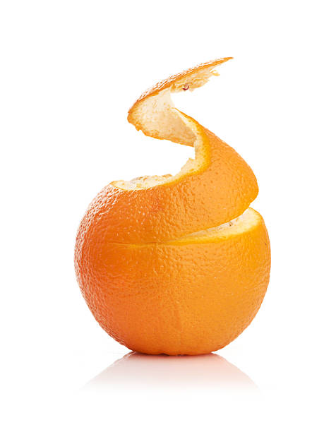 istock orange with peeled spiral skin 451193049