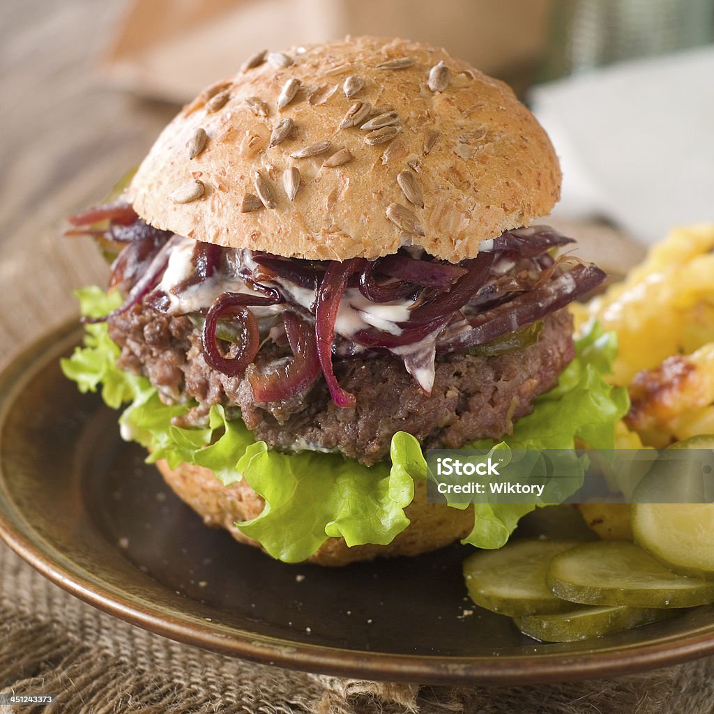 hamburger Hamburger with cucumber and onion, selective focus Bread Stock Photo