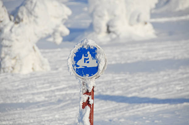 istock Snowmobile sign in a snowy landscape 451245859